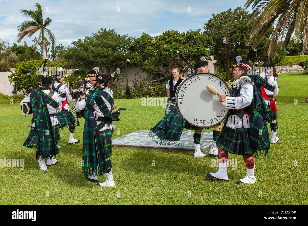 Kilted members of the Bermuda Islands Pipe Band as well as a highland dancer at Fort Hamilton in Hamilton, Bermuda. Stock Photo