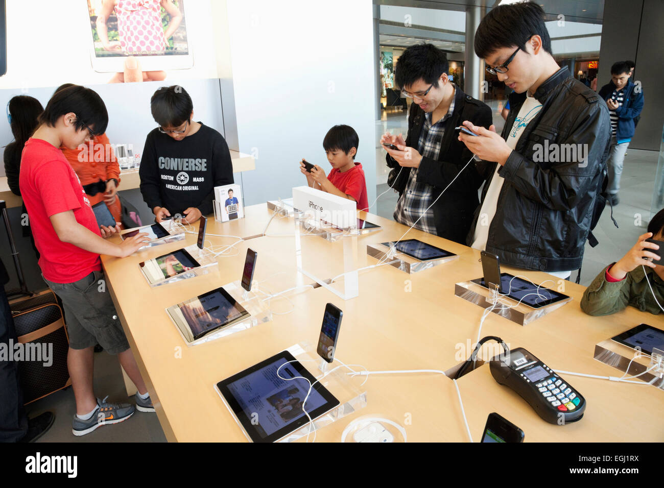 A Salesperson and Customers at an Apple Store Looking at the Latest Apple  IPhone 12 Models for Sale Editorial Stock Photo - Image of consumerism,  design: 203627358