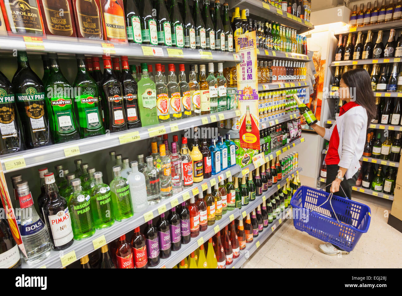 China, Hong Kong, Housewife Buying Imported Wine in Supermarket Stock