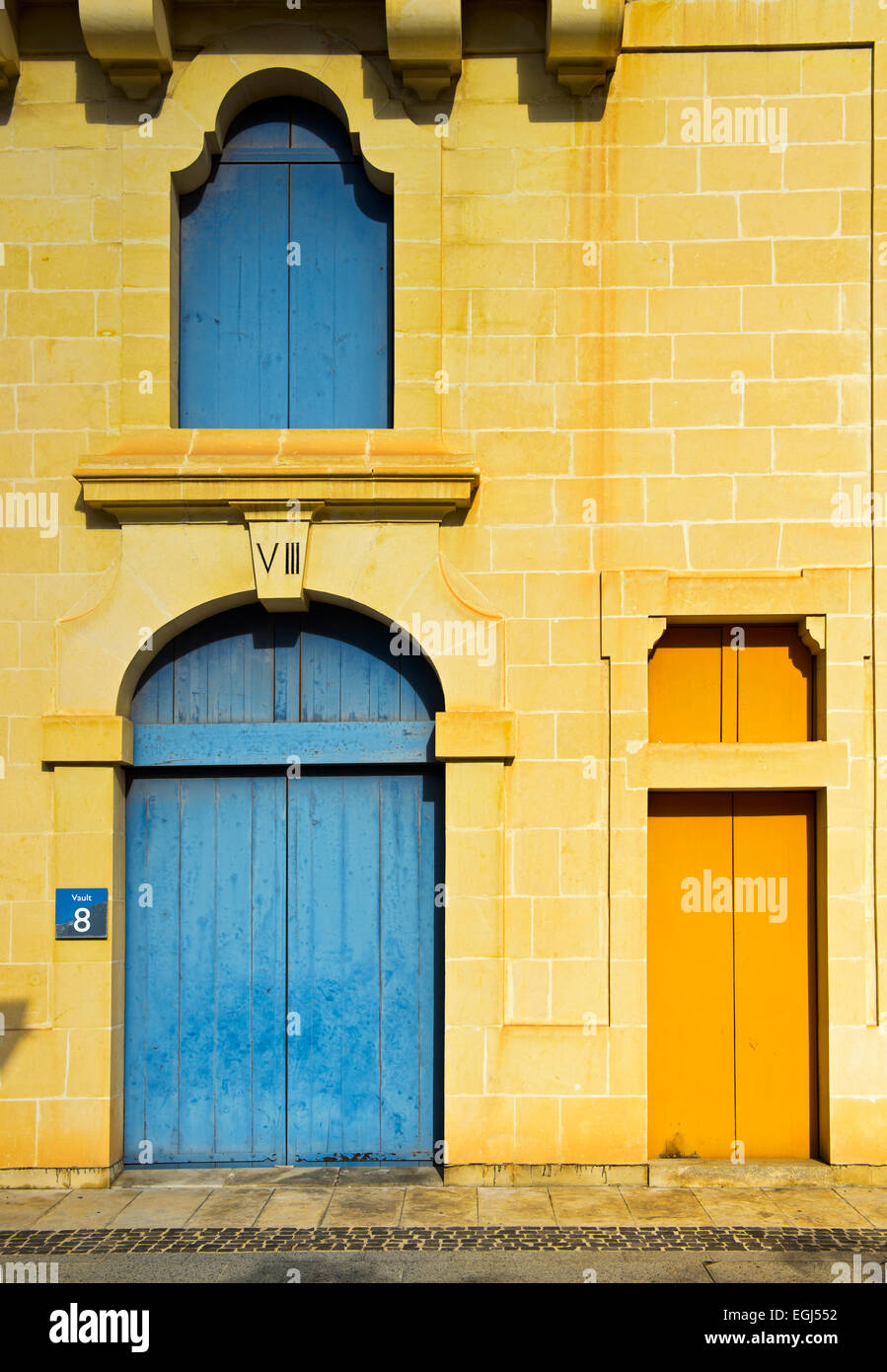 Gate and door of a restored historic warehouse building, Valletta Waterfront, Valletta, Malta Stock Photo