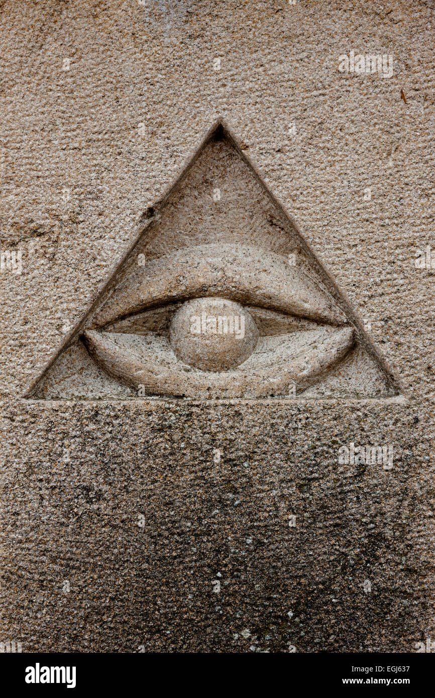 Triangle and eye in stone Stock Photo