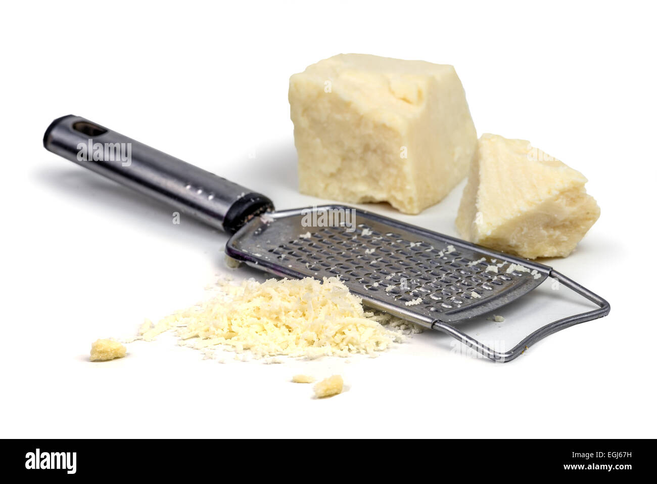 parmesan with grater on wood table Stock Photo