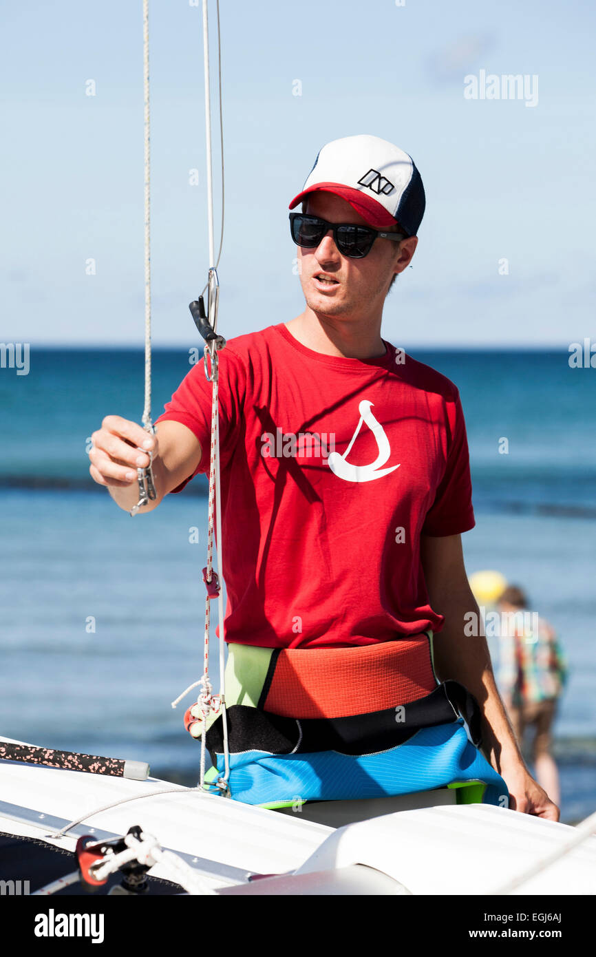 Sailing lesson, teacher demonstrate something at the catamaran Stock Photo