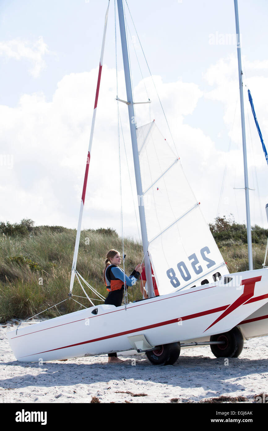 Sailing lessons on catamaran, pulling up of the sail Stock Photo Alamy