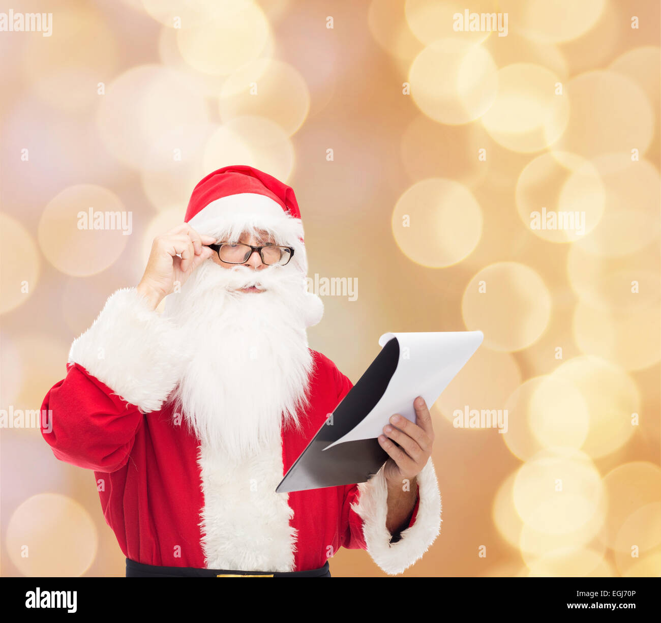 man in costume of santa claus with notepad Stock Photo - Alamy