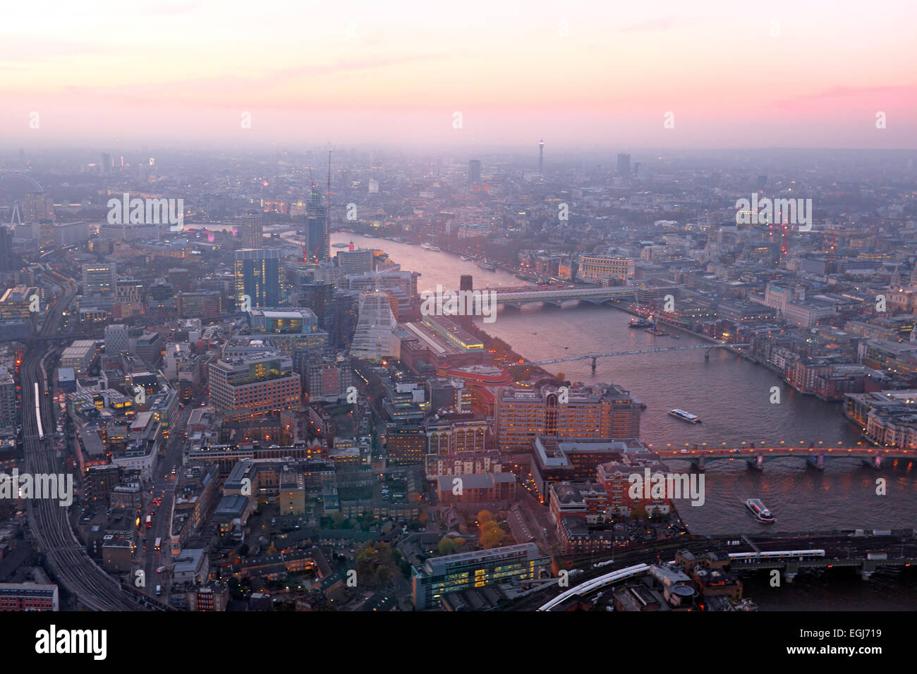 London rooftop view panorama at sunset with urban architectures with Thames River at night Stock Photo