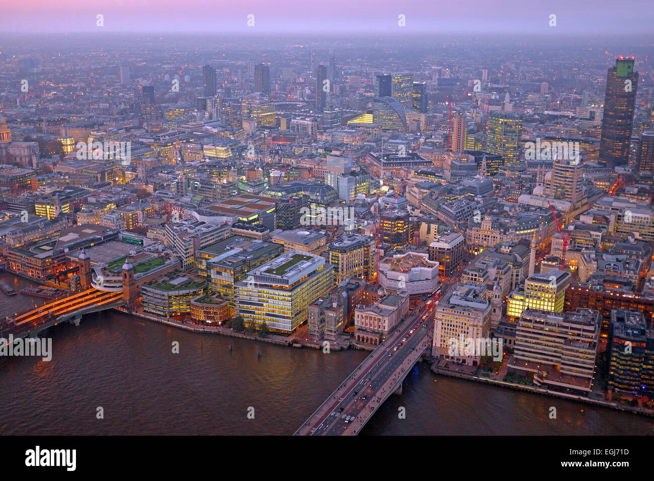 London rooftop view panorama at sunset with urban architectures with Thames River at night Stock Photo