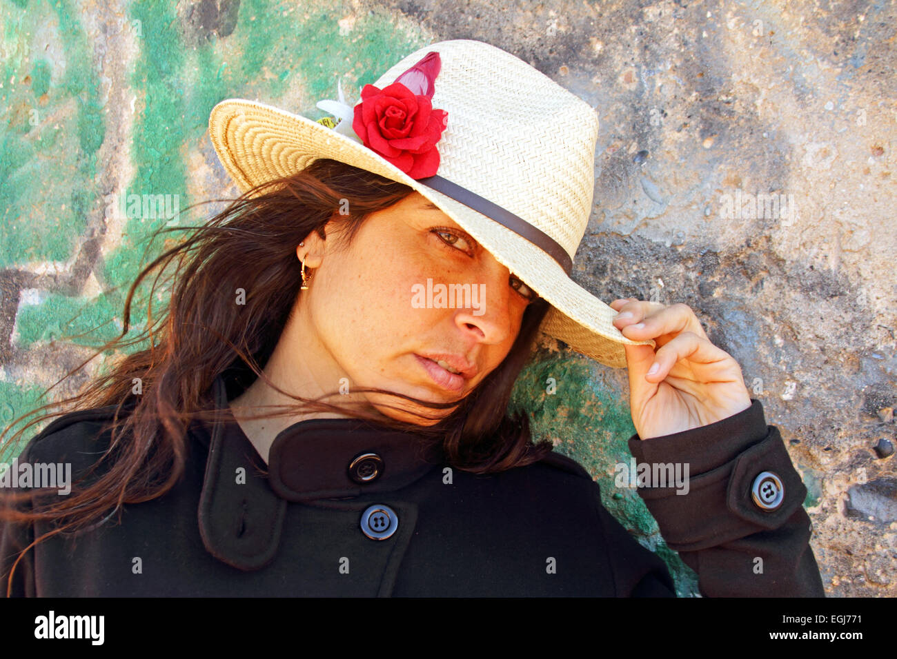 Beautiful woman against a graffiti background Stock Photo