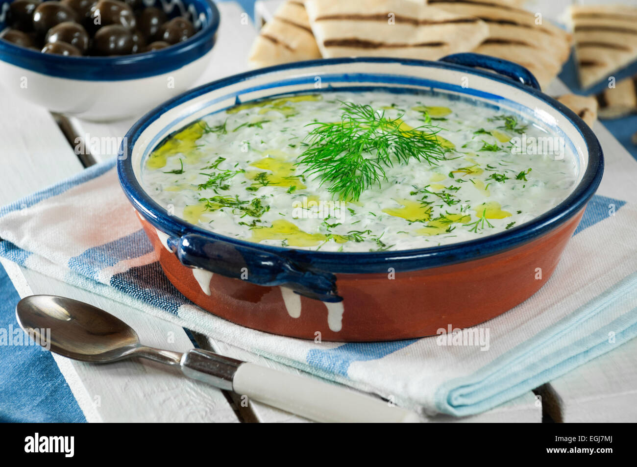 Tzatziki. Yogurt and cucumber relish with pitta bread. Stock Photo