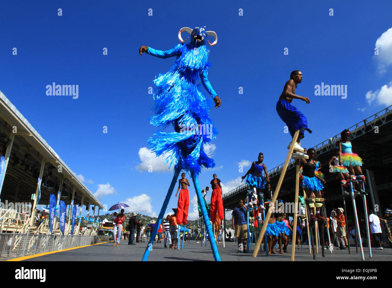 Moko Jumbies dance on the Queen's Park Savannah Stage during the Republic Bank Children's Carnival in Port of Spain, Trinidad. Stock Photo