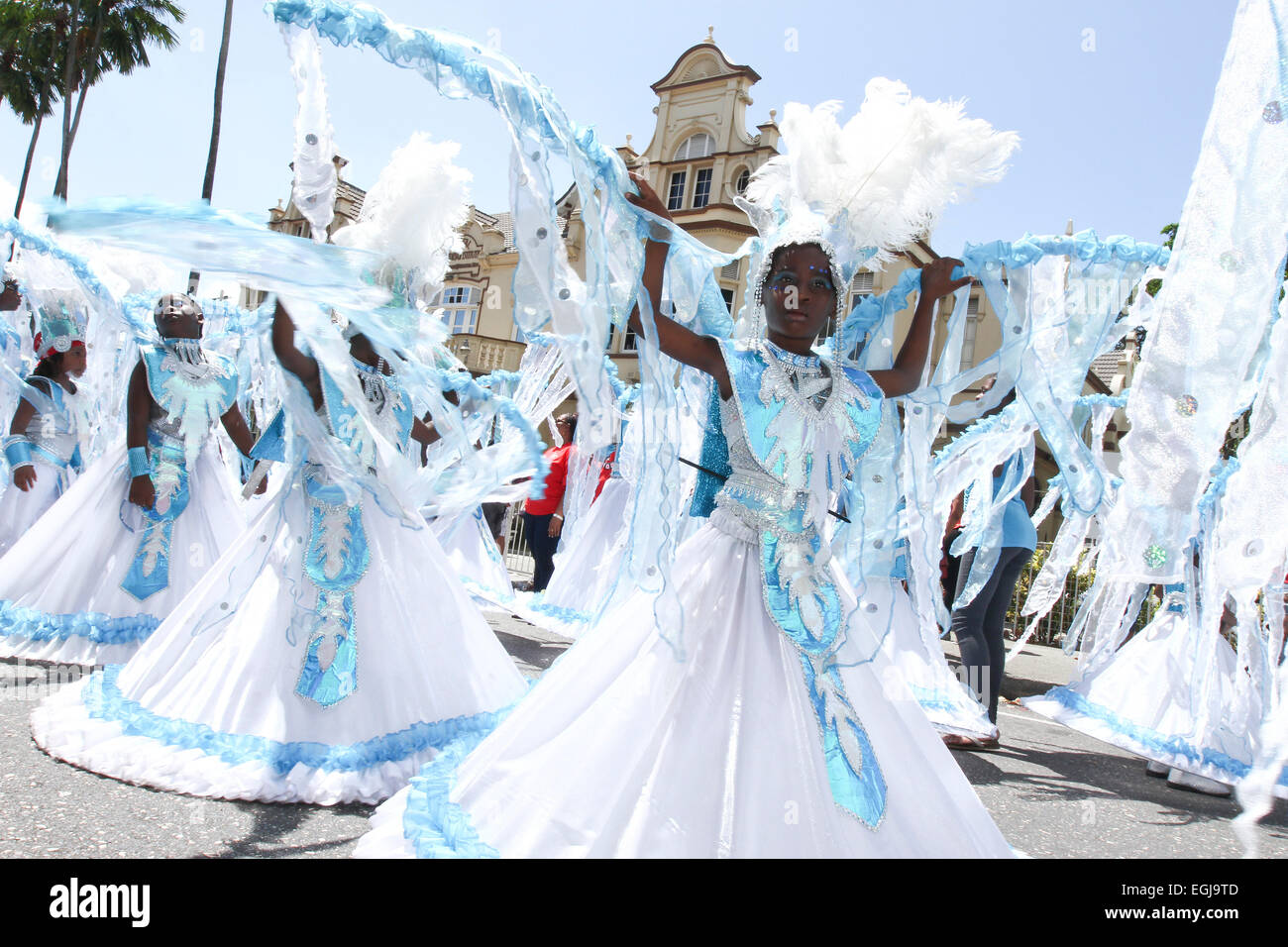 Costumed masqueraders perform on Frederick Street during the Republic Bank Junior Carnival Parade in Port of Spain, Trinidad. Stock Photo
