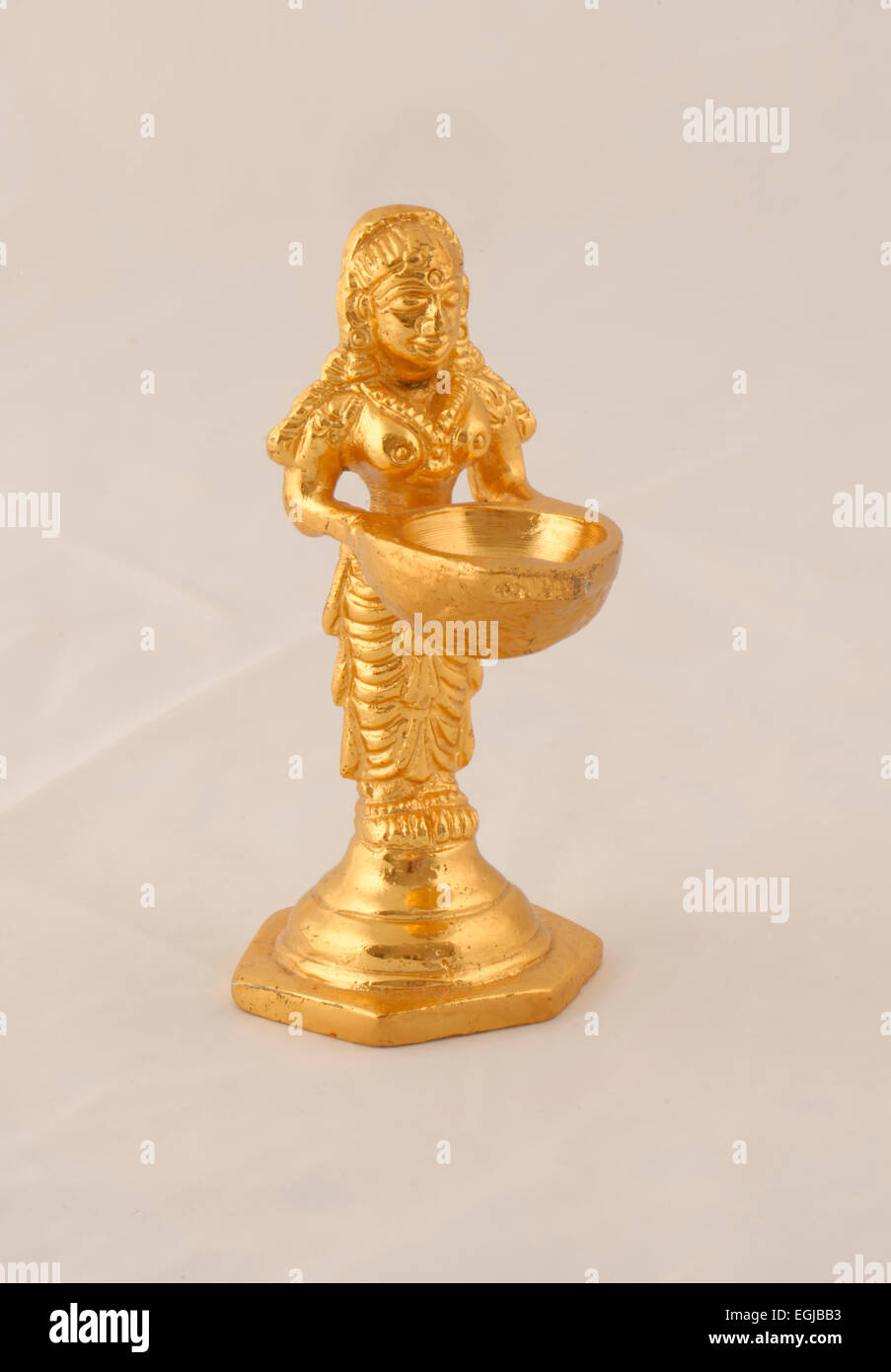 Golden Hindu deity statue carrying water bowl a wedding gift in Sri