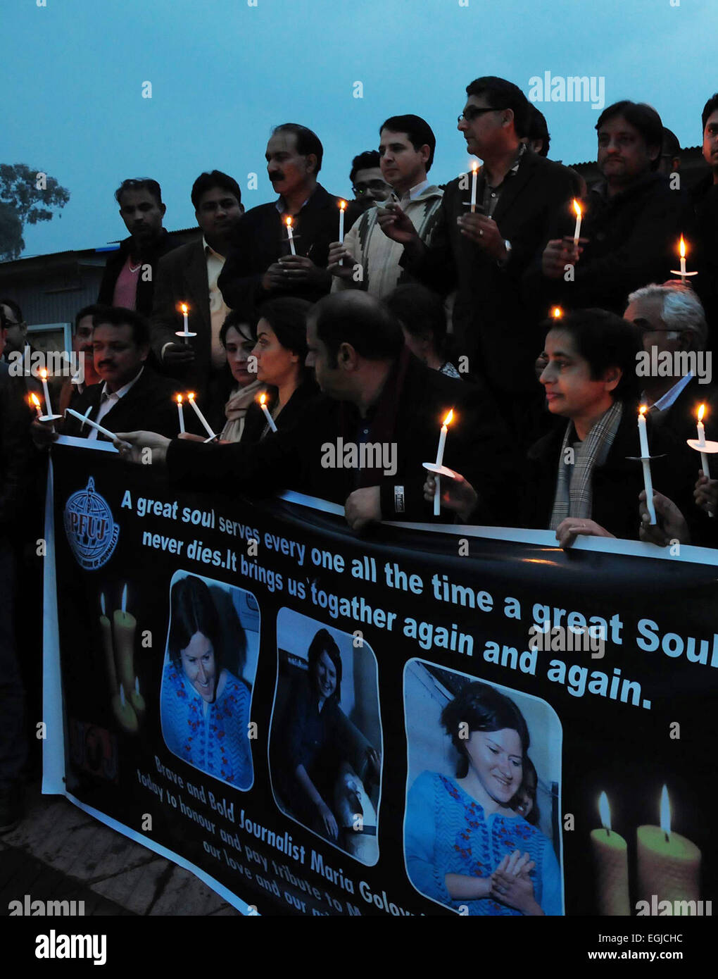 Islamabad, Islamabad. 25th Feb, 2015. Foreign and Pakistani journalists hold candles during a