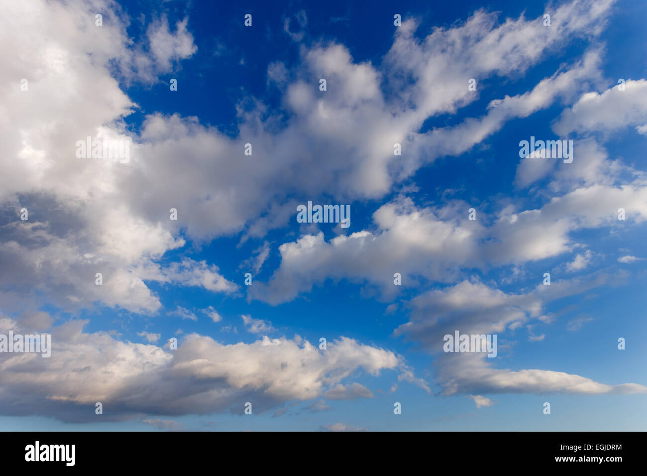 Cloudy blue sky with puffy clouds in winter in Greece Stock Photo