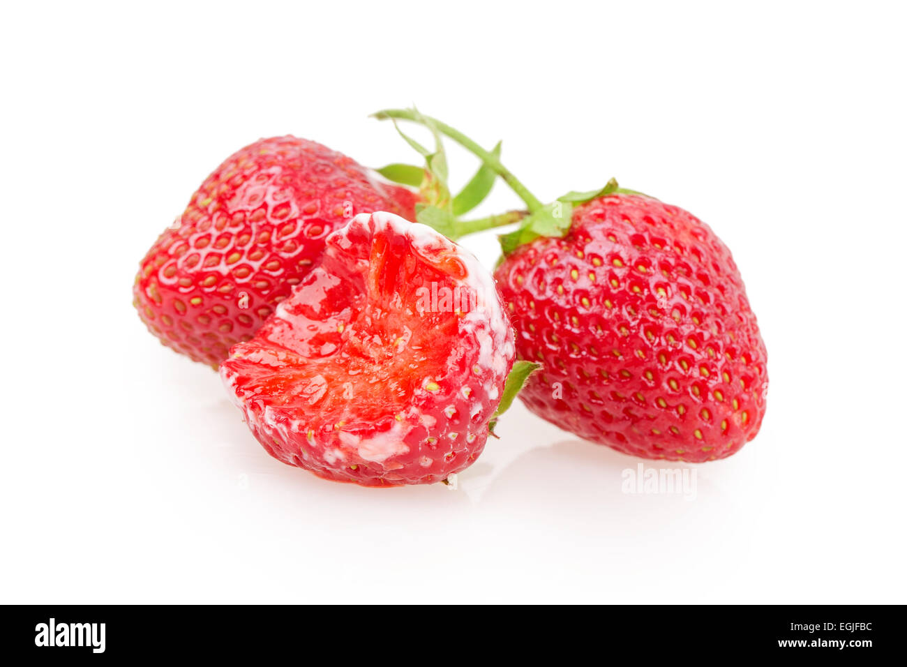 juicy ripe strawberries with leaves on a white background Stock Photo ...
