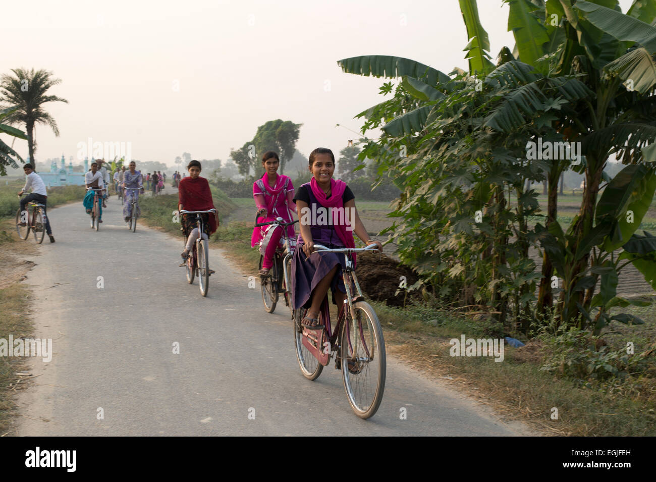 Bihar. India. Mastichak village. Girls cycle home from tutorial class. Stock Photo