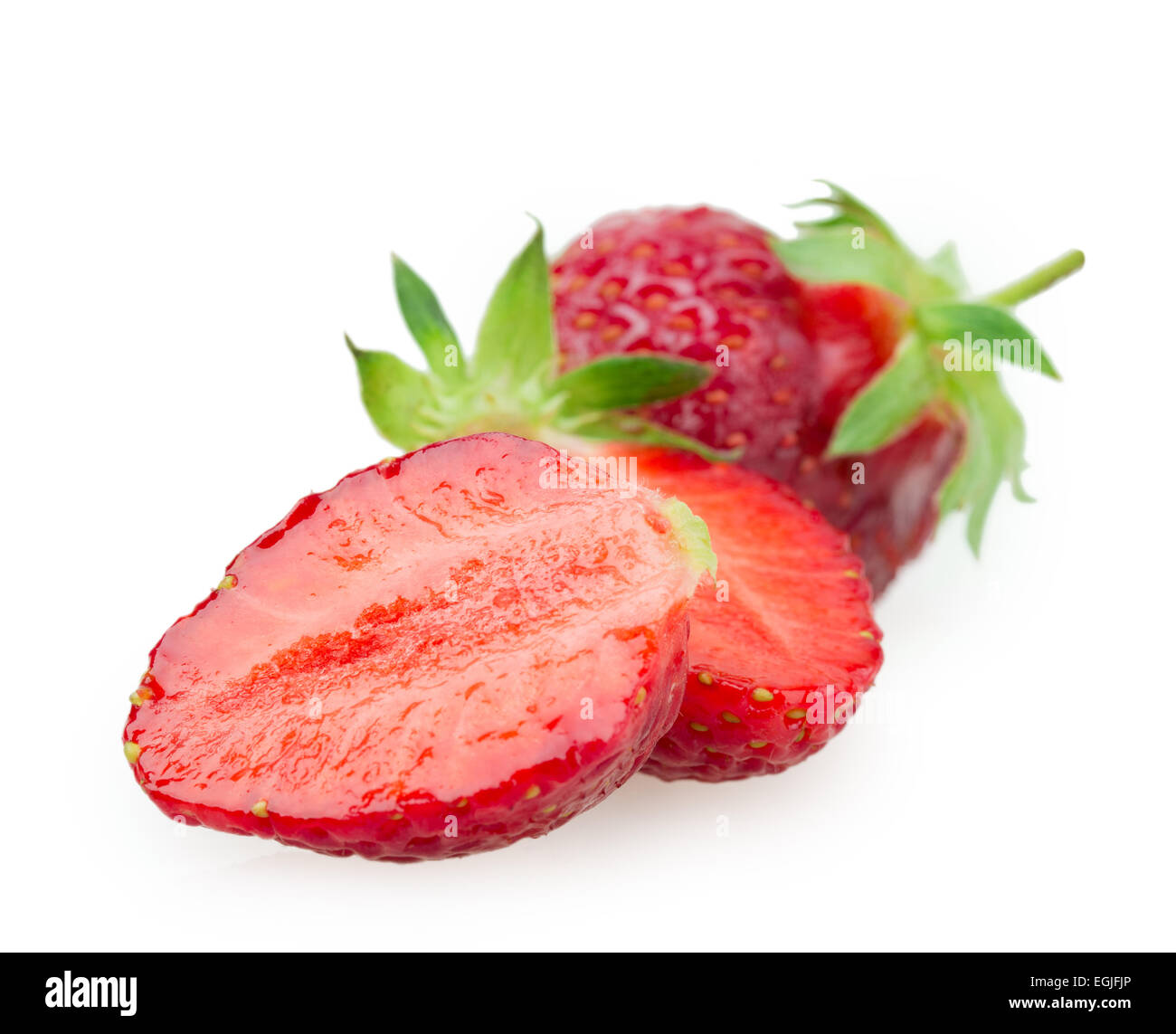 juicy ripe strawberries with leaves on a white background Stock Photo ...