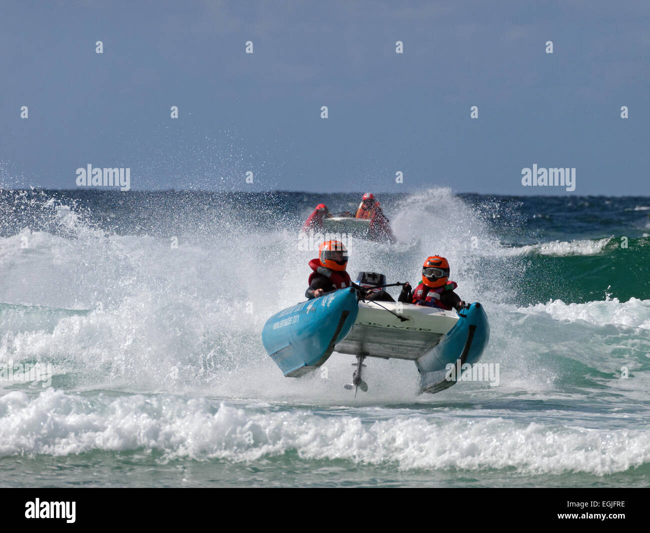 Two man crewed Zap cat racing boat airborne in the surf Stock Photo