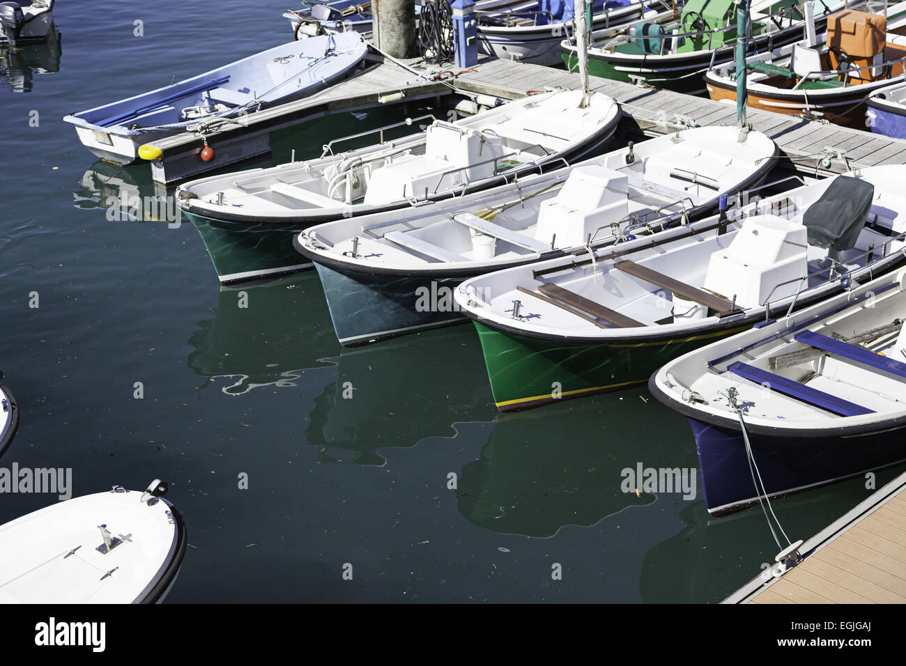 Boats moored at a marine dock, detail of recreational boats on a dock ...
