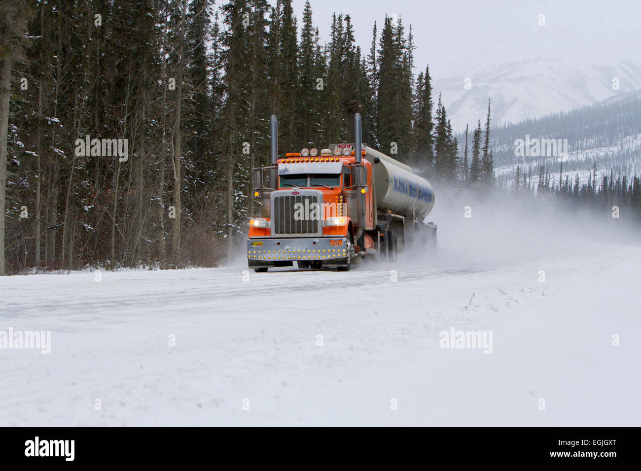 Haulage truck on the Dalton Highway (North Slope Haul Road)  heading for Prudhoe Bay, Alaska, USA in October Stock Photo