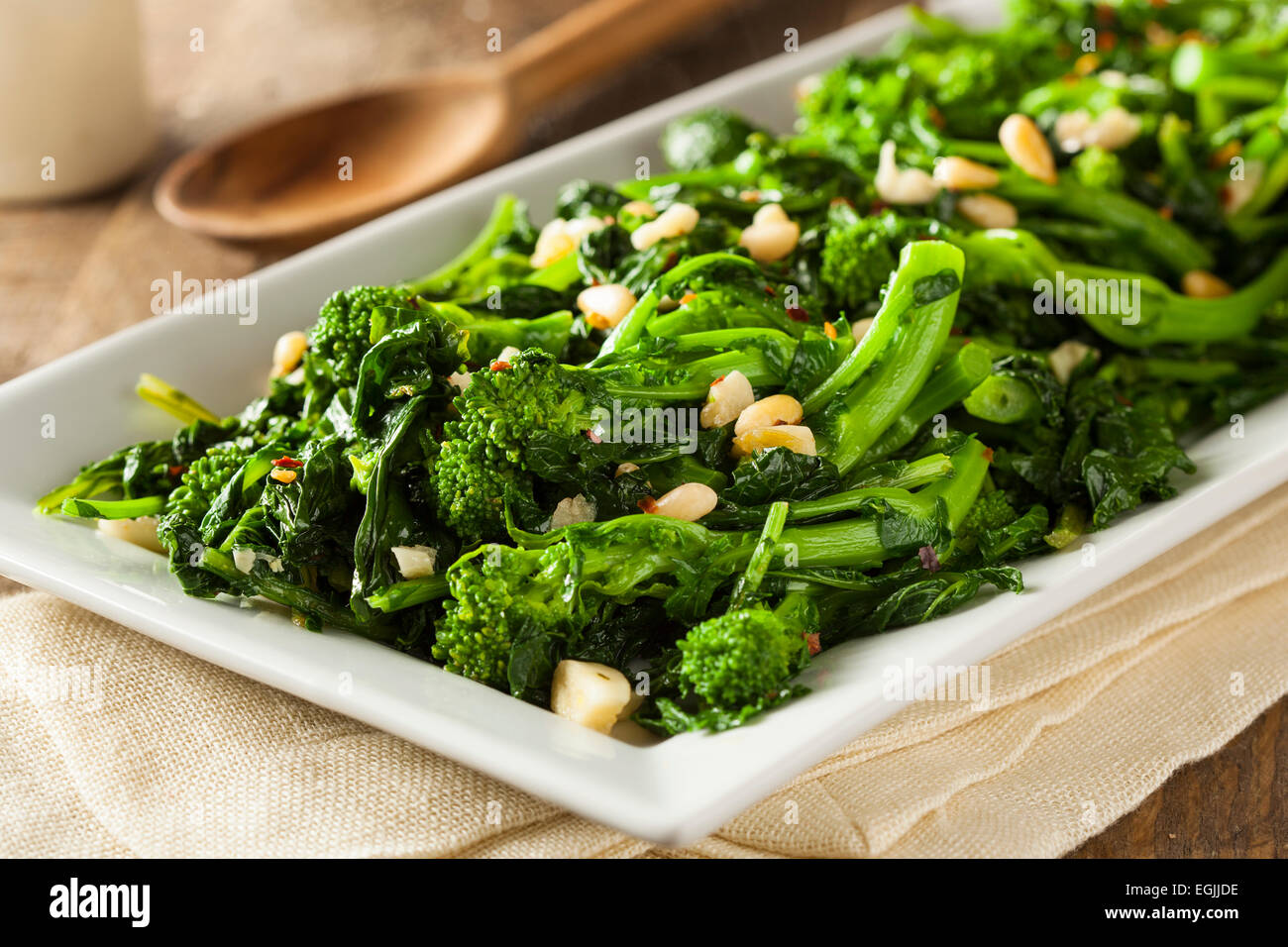 Homemade Sauteed Green Broccoli Rabe with Garlic and Nuts Stock Photo
