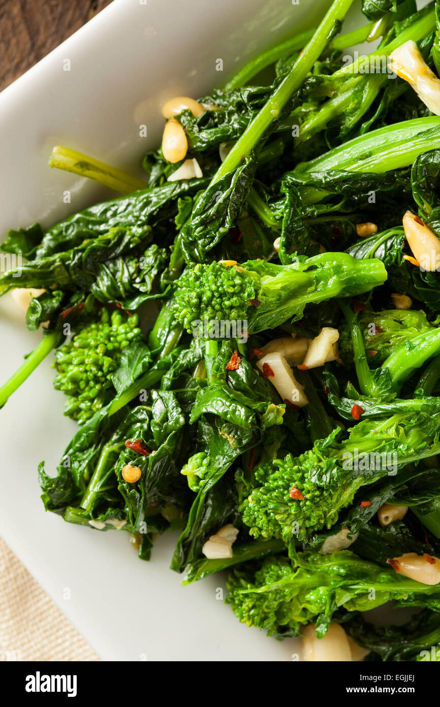 Homemade Sauteed Green Broccoli Rabe with Garlic and Nuts Stock Photo ...