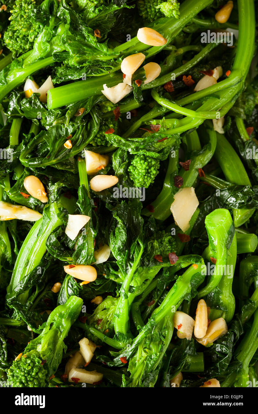 Homemade Sauteed Green Broccoli Rabe with Garlic and Nuts Stock Photo