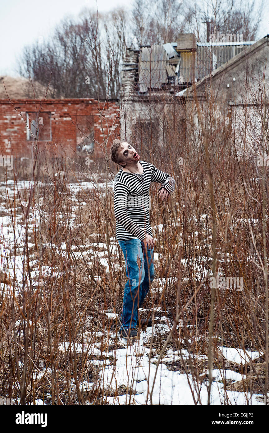 Mad posessed man lost  in the village Stock Photo