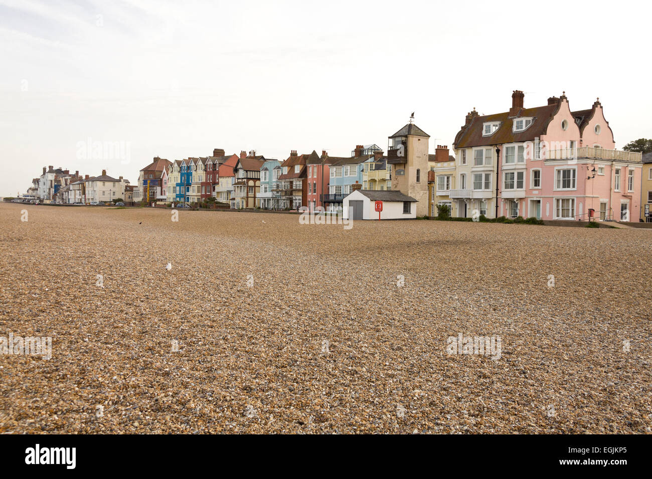 Seafront at Aldeburgh Suffolk from the shingle beach with houses and fishermens lookout tower Stock Photo