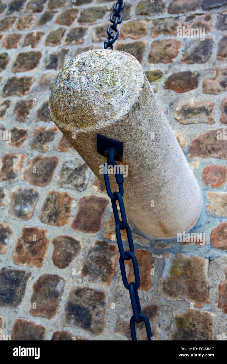 Stone stud and chain on a cobbled square Stock Photo
