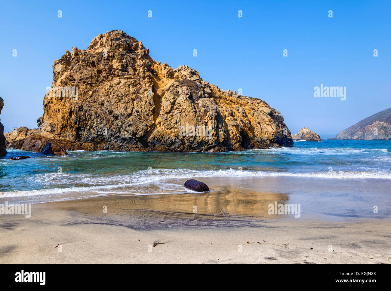 Pfeiffer Arch rock formation in the ocean viewed from Pfeiffer Beach. Pfeiffer Big Sur State Park, California, United States. Stock Photo
