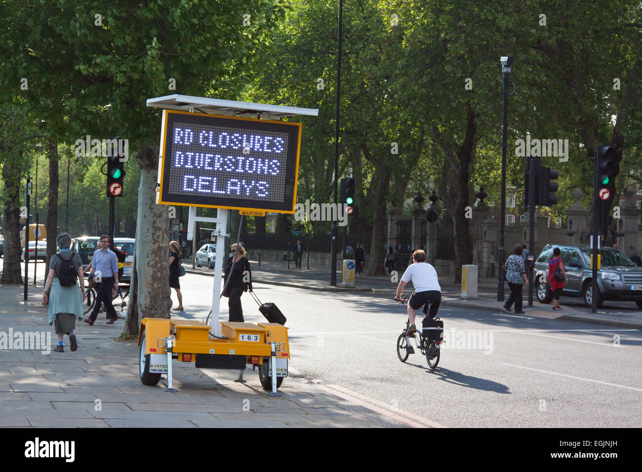 Illuminated mobile sign for road works and diversions London Stock Photo