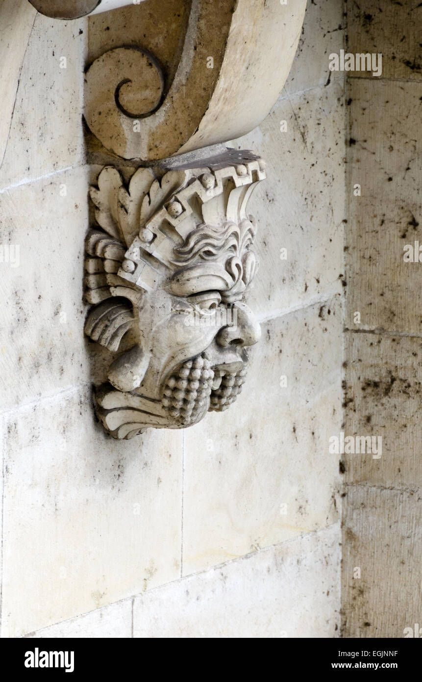 A bizarre face ornaments a corbel underneath the Pont Neuf, Paris, France. Stock Photo
