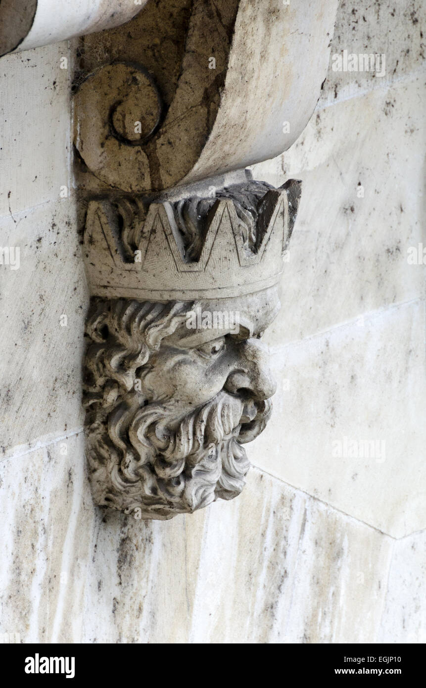 The carved face of a bearded king ornaments a corbel underneath the Pont Neuf, Paris, France. Stock Photo
