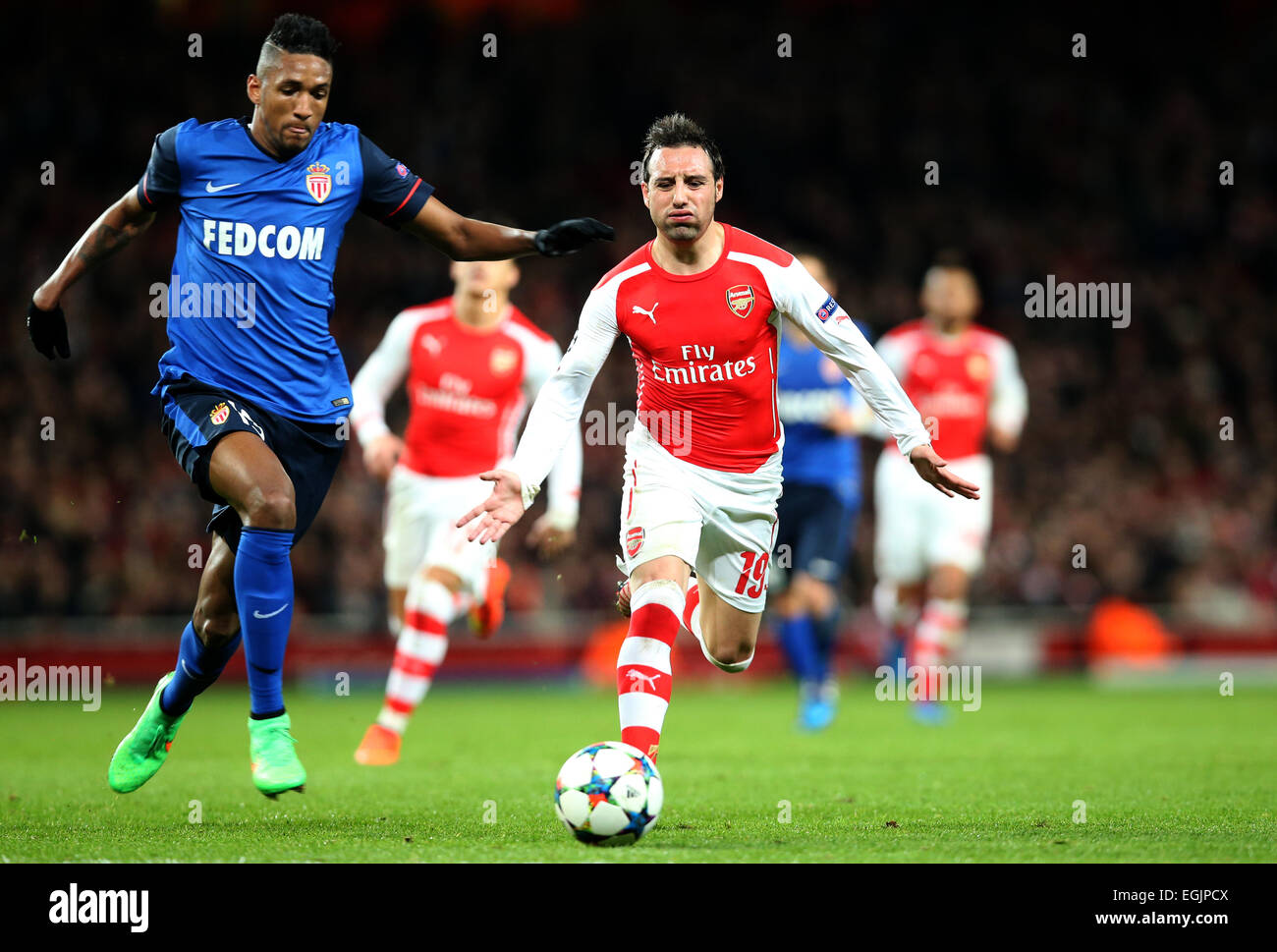 London, UK. 25th Feb, 2015. Santi Cazorla (R) of Arsenal vies with Wallace of Monaco during the UEFA Champions league Round of 16 first leg match between Arsenal and Monaco at the Emirates Stadium in London, Britain, on Feb. 25, 2015. Monaco won 3-1. Credit:  Han Yan/Xinhua/Alamy Live News Stock Photo