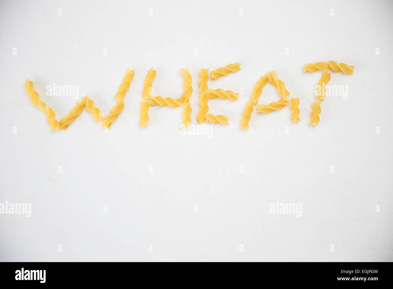 The Word Wheat written in pasta Stock Photo