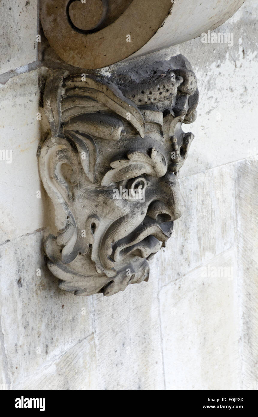 The carved face of a Green Man ornaments a corbel underneath the Pont Neuf, Paris, France. Stock Photo