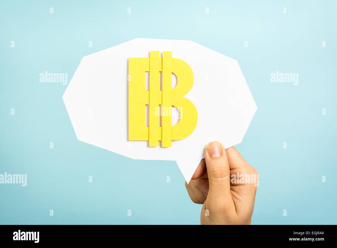 Bitcoin sign/symbol, virtual currency/money on speech bubble and blue background. Stock Photo