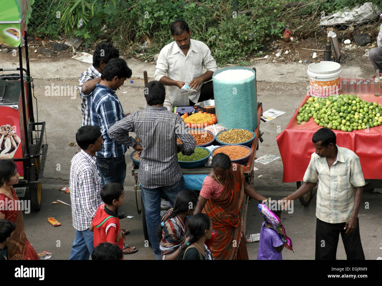 street food vendors sell on mobile carts during ganesha immersion