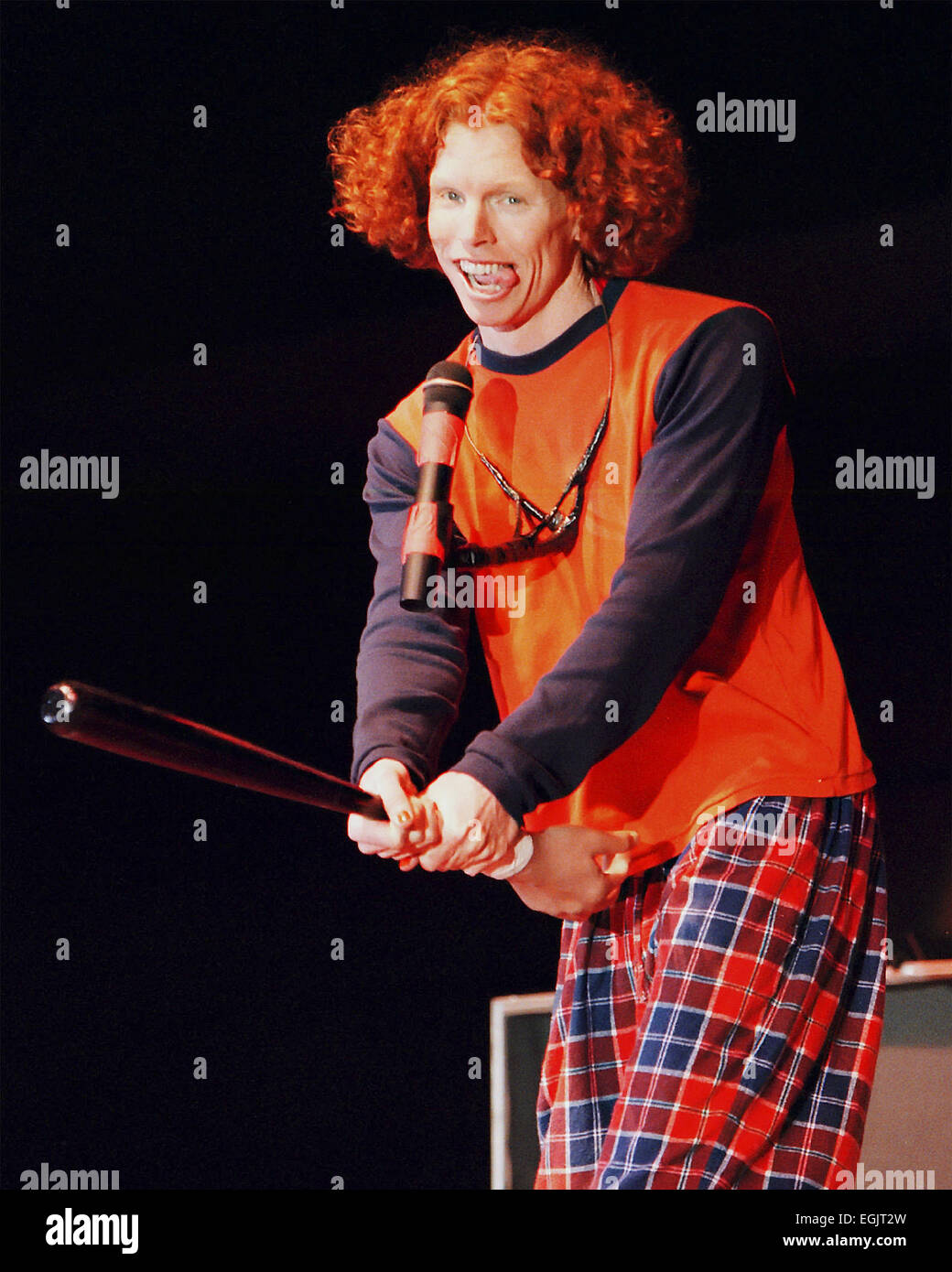 Stand-up Carrot Top, 30, whose name is Scott entertains an audience with his baseball schtick during a show at the field of Missouri Western State College on Monday,