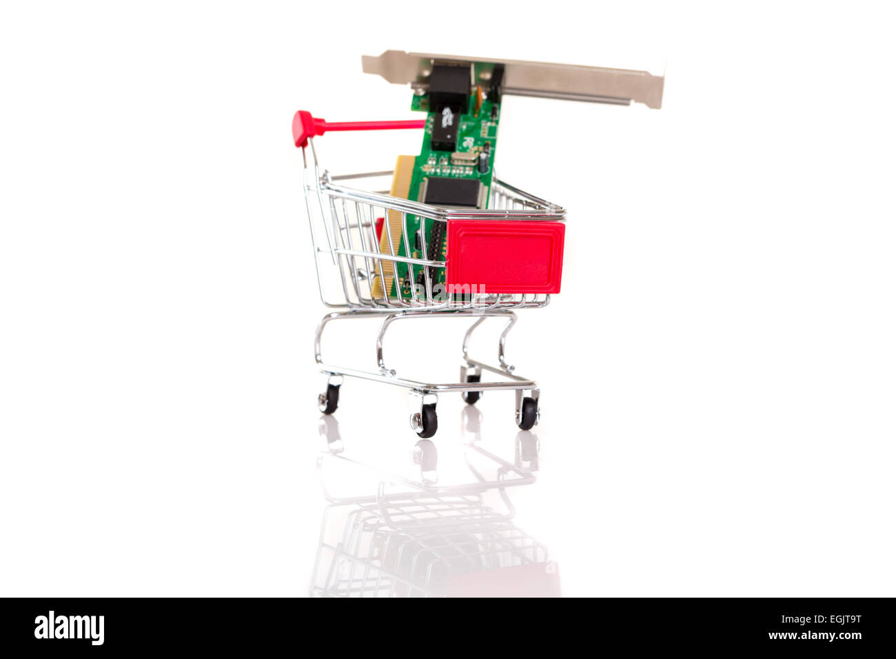 Small shopping cart with computer hardware, isolated over white Stock