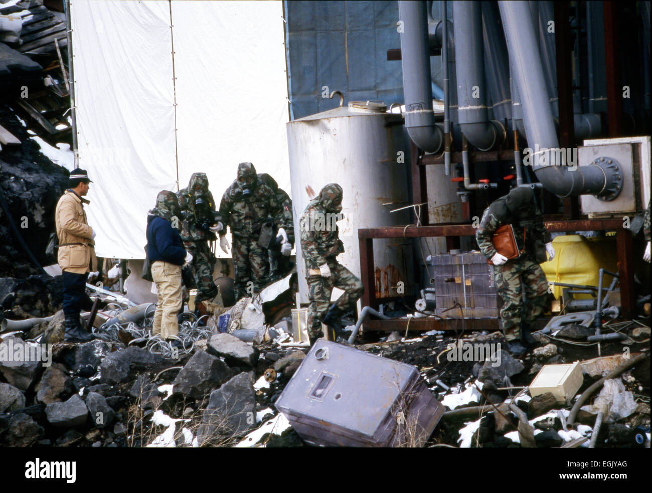 March, 1995, Kamikuisshiki Mura, Japan - Police confiscate explosives, chemical weapons and biological warfare agents during a raid on Aum's facility - No. 7 Satyam - on the foot of Mt. Fuji in March 1995. On the morning of 20 March 1995, cult members released sarin in a coordinated attack on five trains in the Tokyo subway system, killing 13 commuters, seriously injuring 54 and affecting 980 more. Some estimates claim as many as 6,000 people were injured by the sarin. © Haruyoshi Yamaguchi/AFLO/Alamy Live News Stock Photo
