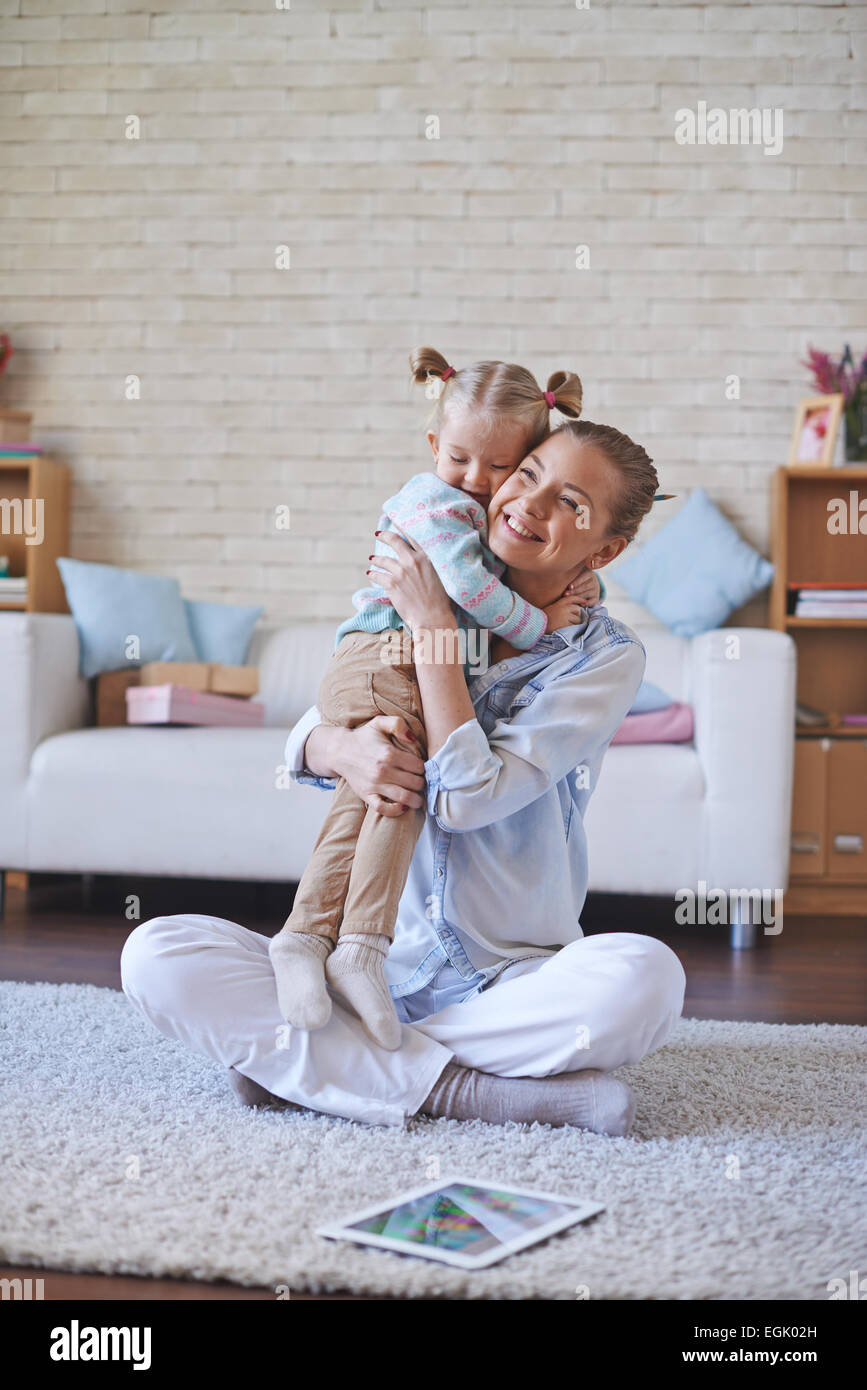 Happy woman and her daughter in embrace Stock Photo
