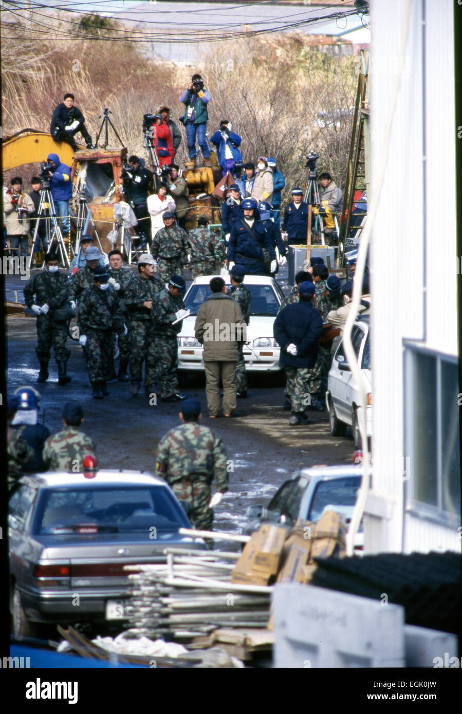 March, 1995, Kamikuisshiki Mura, Japan - Police confiscate explosives, chemical weapons and biological warfare agents during a raid on Aum's facility - No. 7 Satyam - on the foot of Mt. Fuji in March 1995. On the morning of 20 March 1995, cult members released sarin in a coordinated attack on five trains in the Tokyo subway system, killing 13 commuters, seriously injuring 54 and affecting 980 more. Some estimates claim as many as 6,000 people were injured by the sarin. © Haruyoshi Yamaguchi/AFLO/Alamy Live News Stock Photo