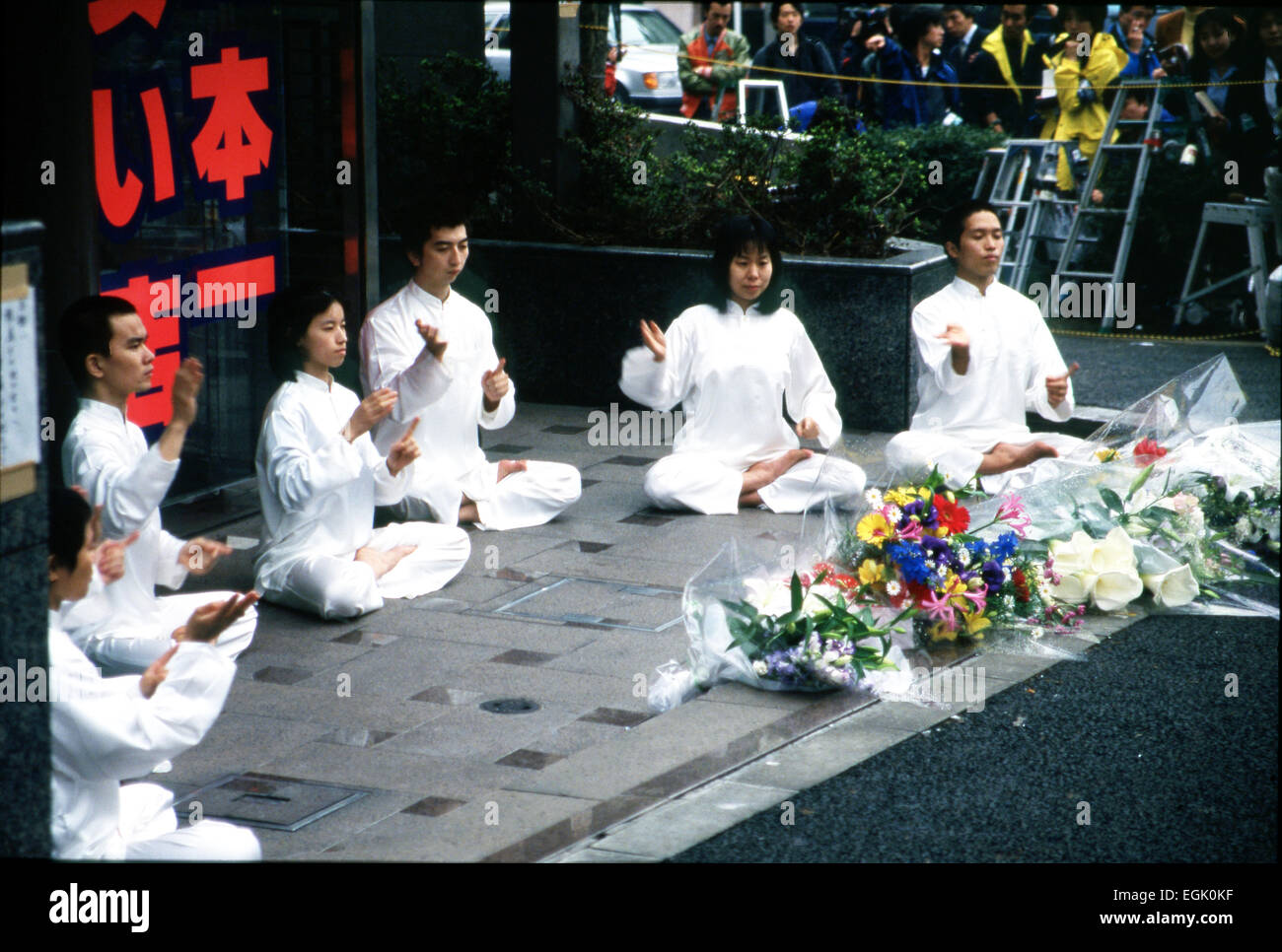 April, 1995, Tokyo, Japan - Members of Aum perform commemorative dance, mourning over the death of Hideo Murai at the cult's headquarters in Tokyo's upscale neighborhood of Aoyama in April 1995. Murai, the head of Aum's ministry of science, was stabbed to death outside the headquarters by a Korean member of the nation's biggest mob group Yamaguchi-gumi. © Haruyoshi Yamaguchi/AFLO/Alamy Live News Stock Photo