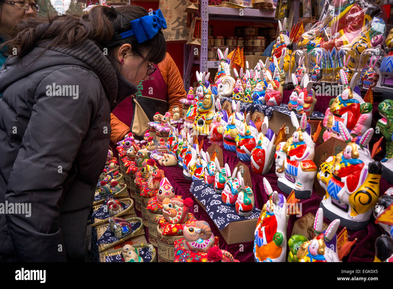 Tourist visit a traditional clay handicrafts stall in Beijing Ditan temple fair. Stock Photo