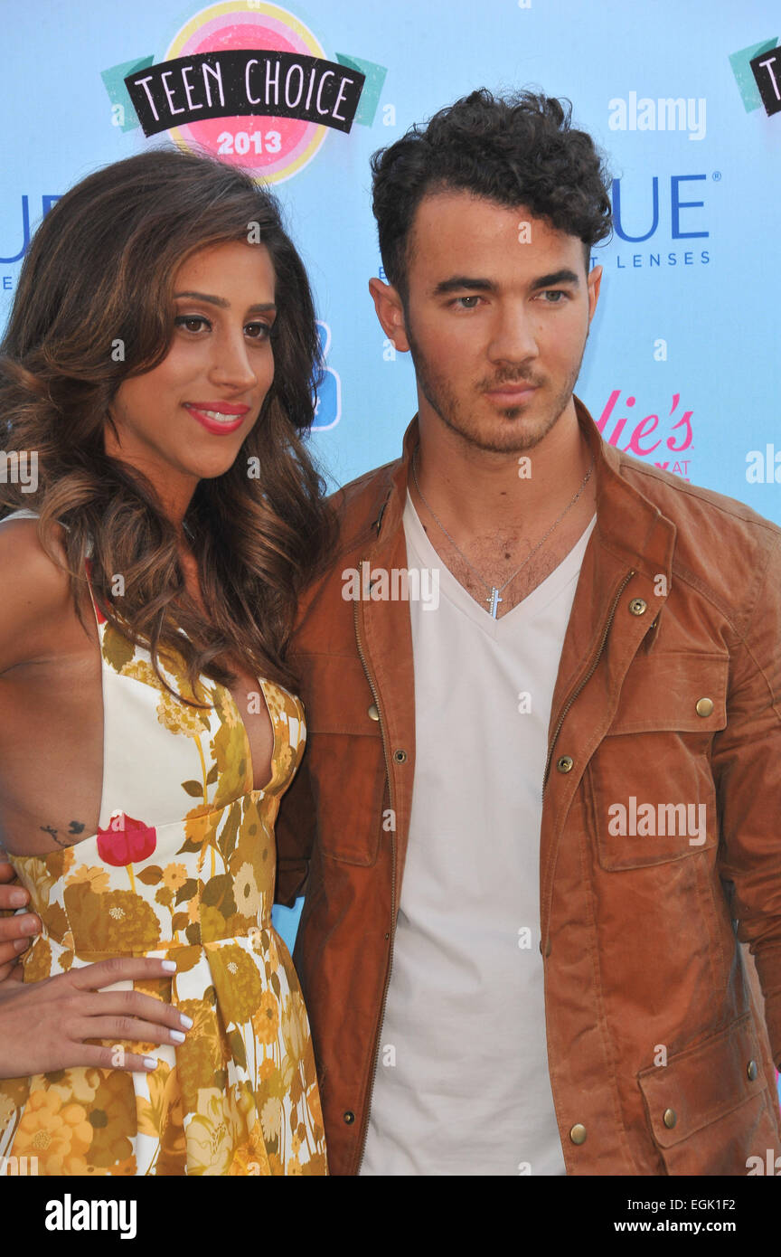 LOS ANGELES, CA - AUGUST 11, 2013: Joe Jonas & date at the 2013 Teen Choice Awards at the Gibson Amphitheatre, Universal City, Hollywood. Stock Photo