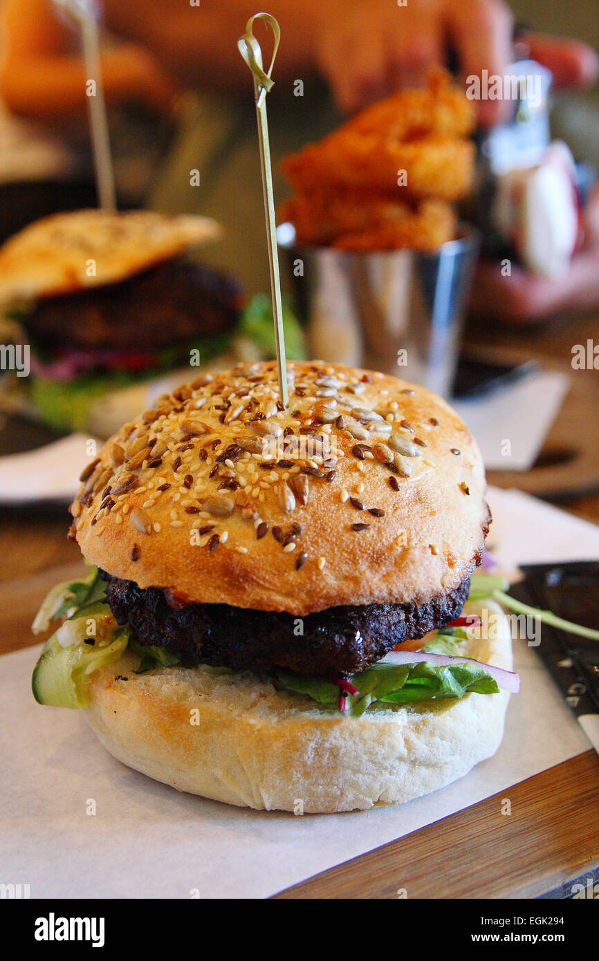 Close up of Beef Burger with Multigrain Bun Stock Photo