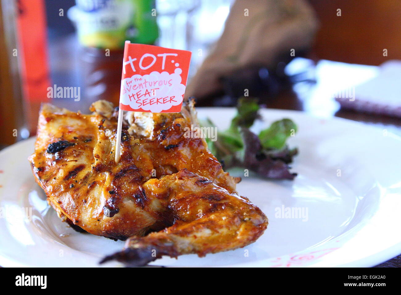 Nandos Chicken  wing with lettuce on a plate Stock Photo