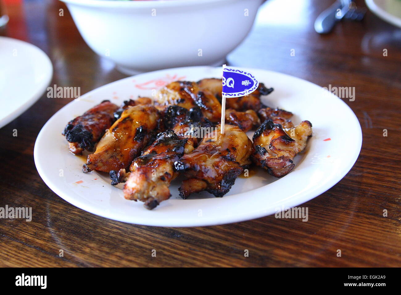 Nandos Chicken pieces on a plate Stock Photo